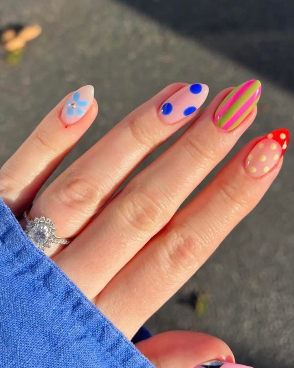 Playful almond nails with polka dots and stripes